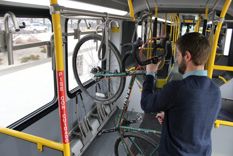 Cyclist loads a bike into rack inside ORBT