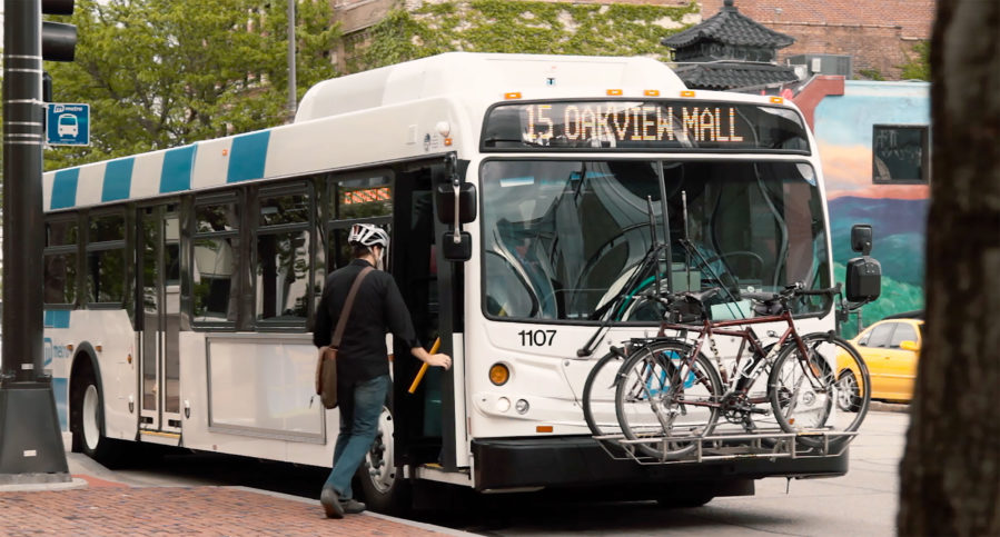 Cyclist boards a Metro bus