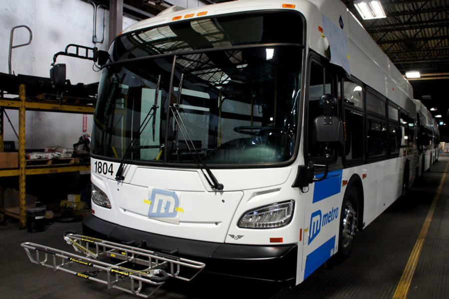 Painting stripes on Metro bus