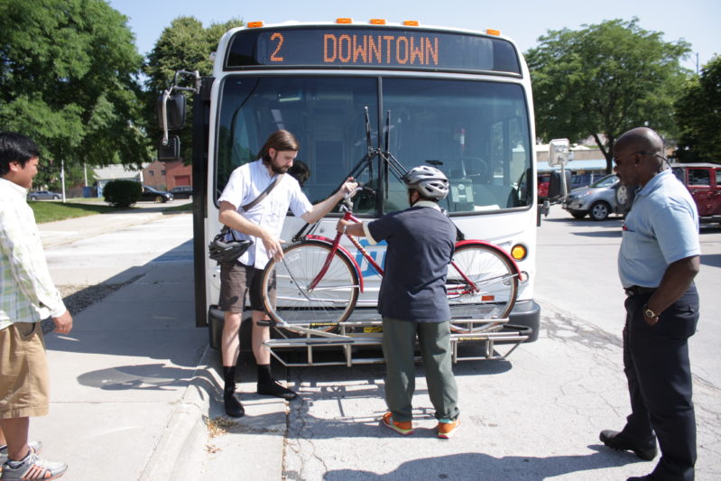 Cyclist loads a bike onto the bus