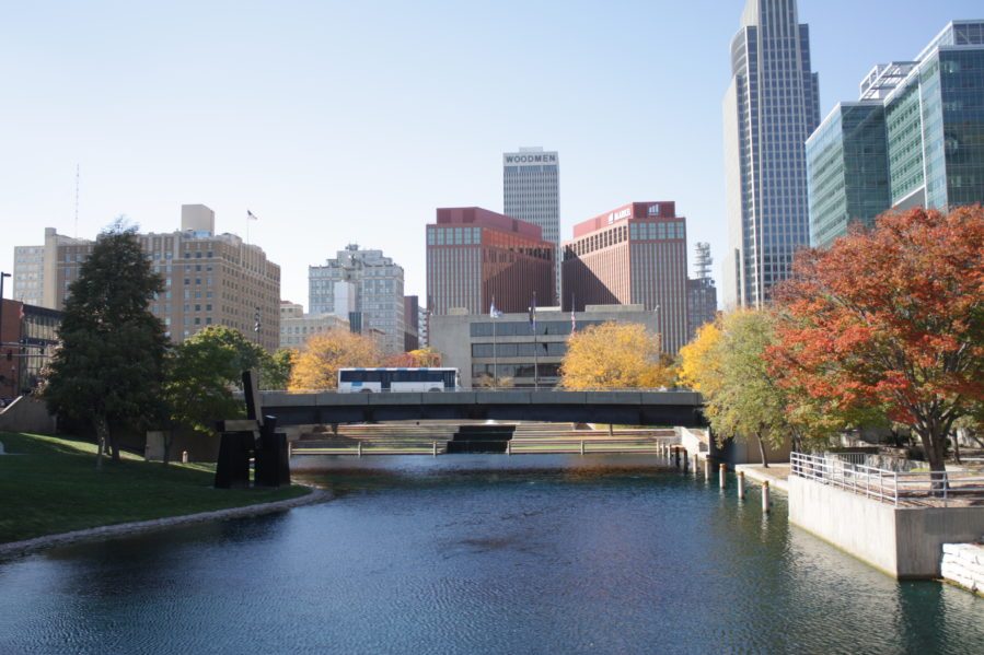 Metro driving over bridge with Omaha skyline in the background