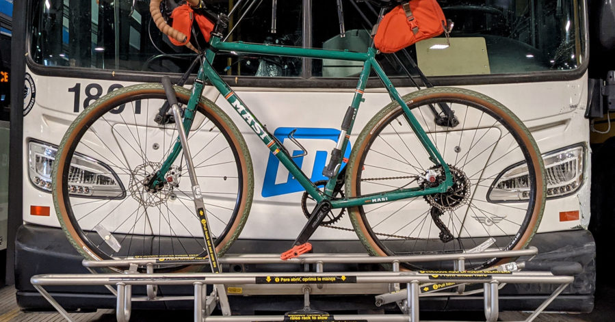Photo of a bike on a front bike rack on a Metro bus