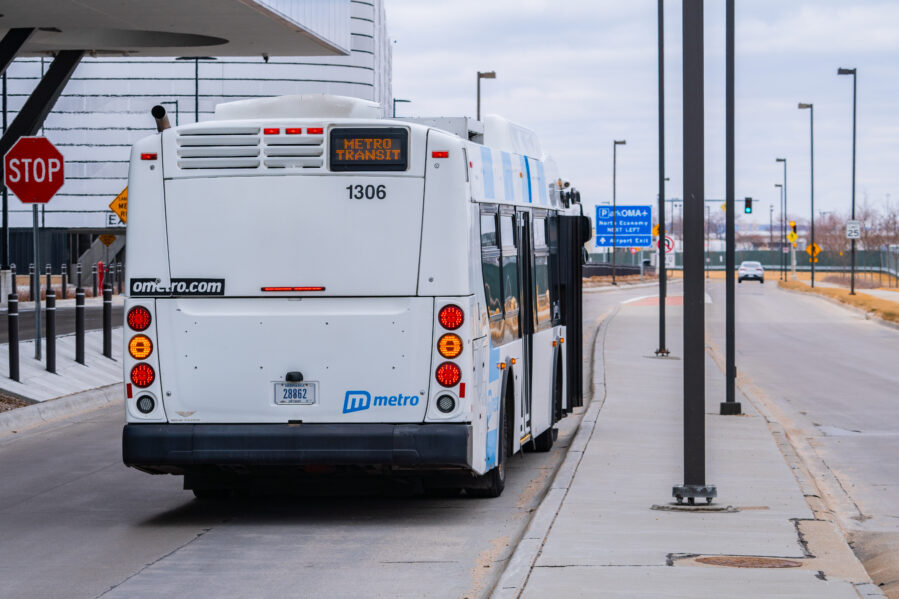 A picture of a bus near the Eppley airfield. the LED sign says Metro Transit